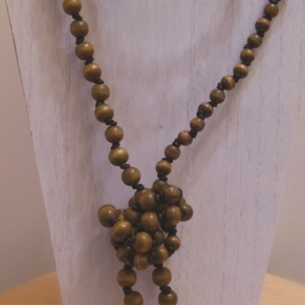 Wooden beads on leather cord